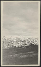 Man standing off in the distance, El Rito de los Frijoles, New Mexico